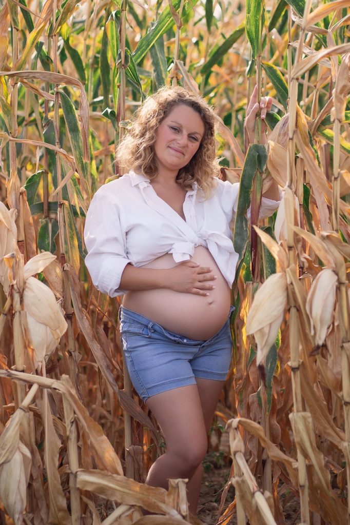 woman, pregnancy, motherhood, field, outfit, fashion, smile, happiness